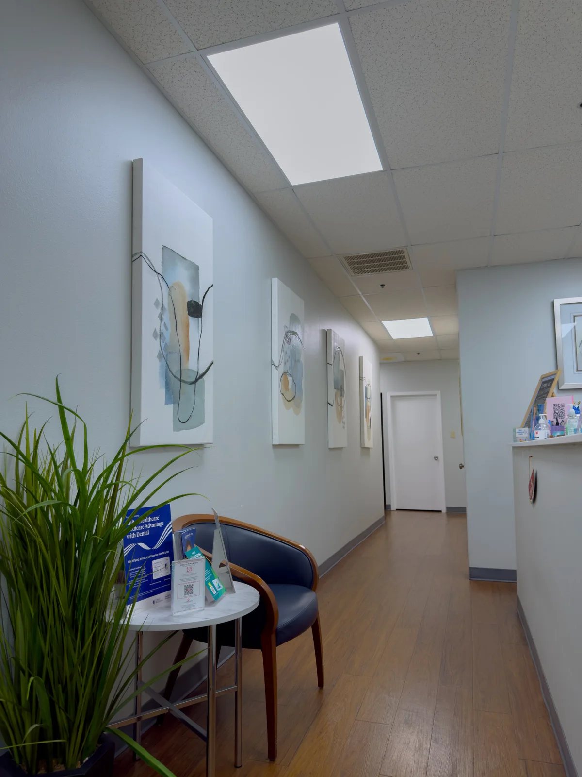 Reception hallway with seating and a plant