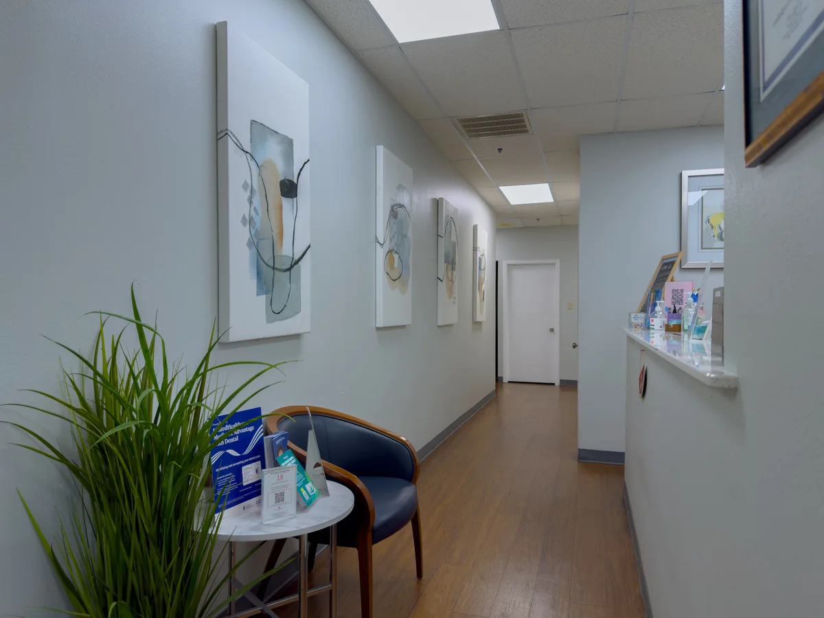 Hallway and reception counter at Arlington Dental Associates